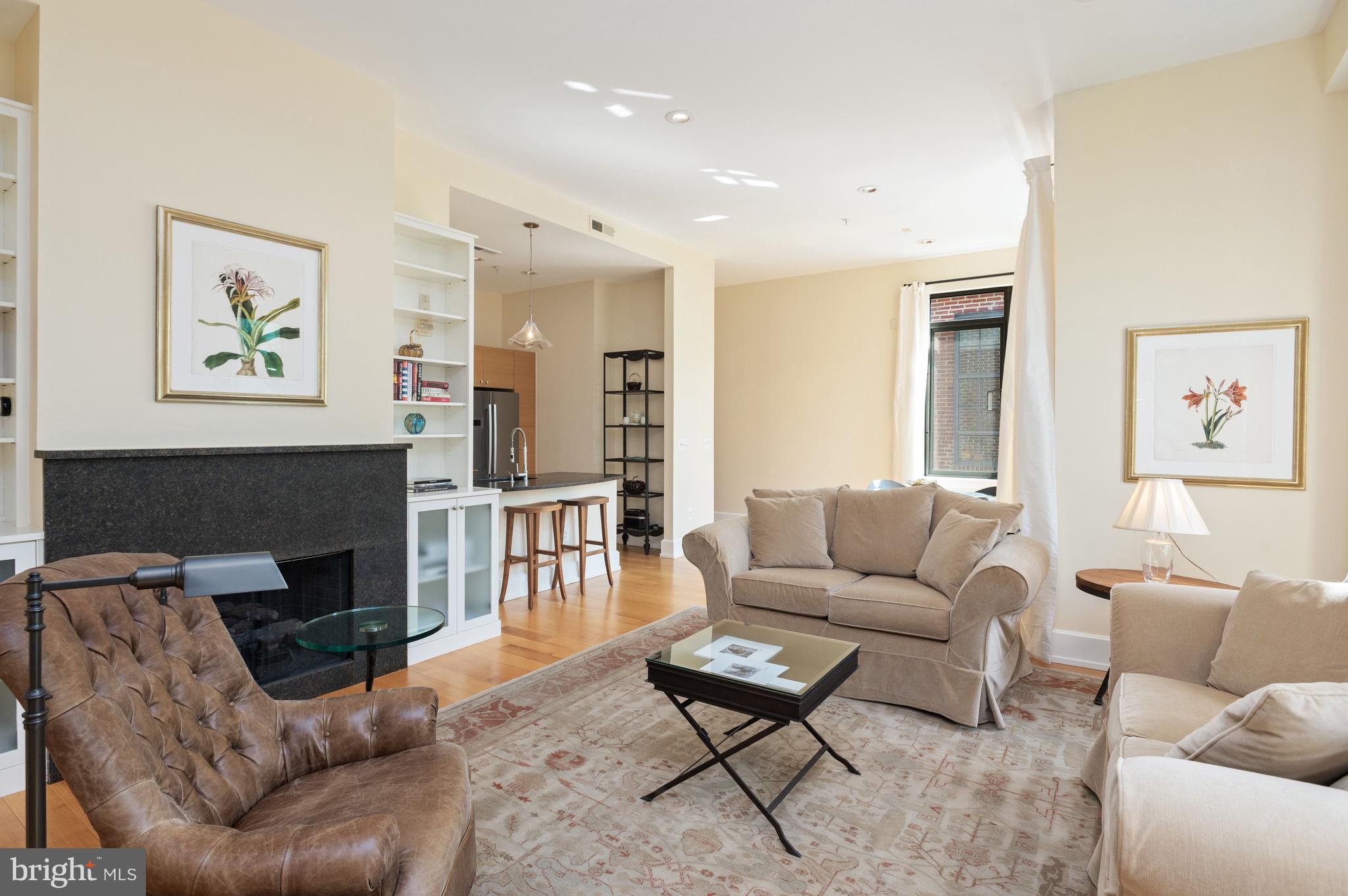 2516 Q Street Northwest, Unit C201 Washington, DC 20007 - Photo 1 of 20 a living room with furniture and a fireplace
