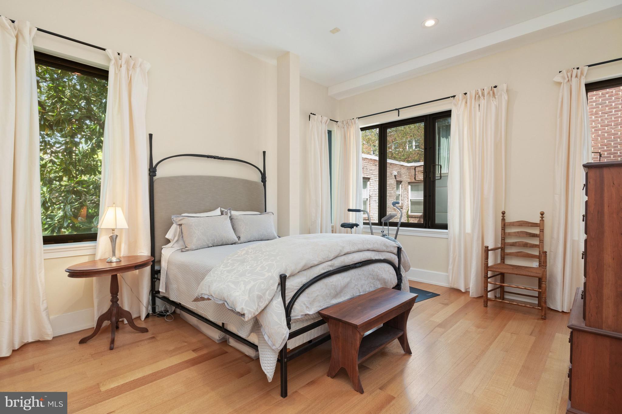 2516 Q Street Northwest, Unit C201 Washington, DC 20007 - Photo 11 of 20 a bedroom with a bed chair and a window