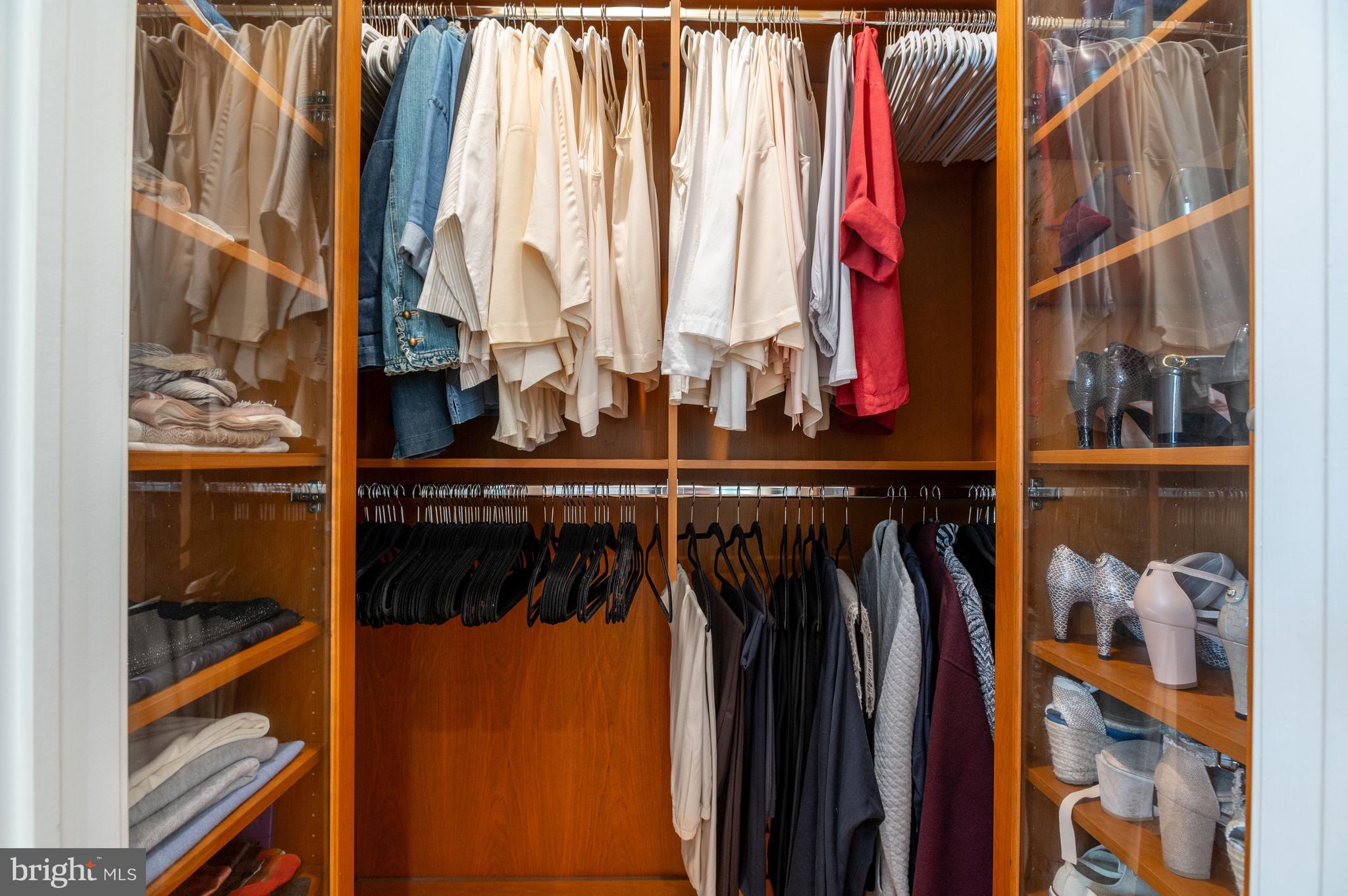 2516 Q Street Northwest, Unit C201 Washington, DC 20007 - Photo 13 of 20 a view of walk in closet with clothes and shoes