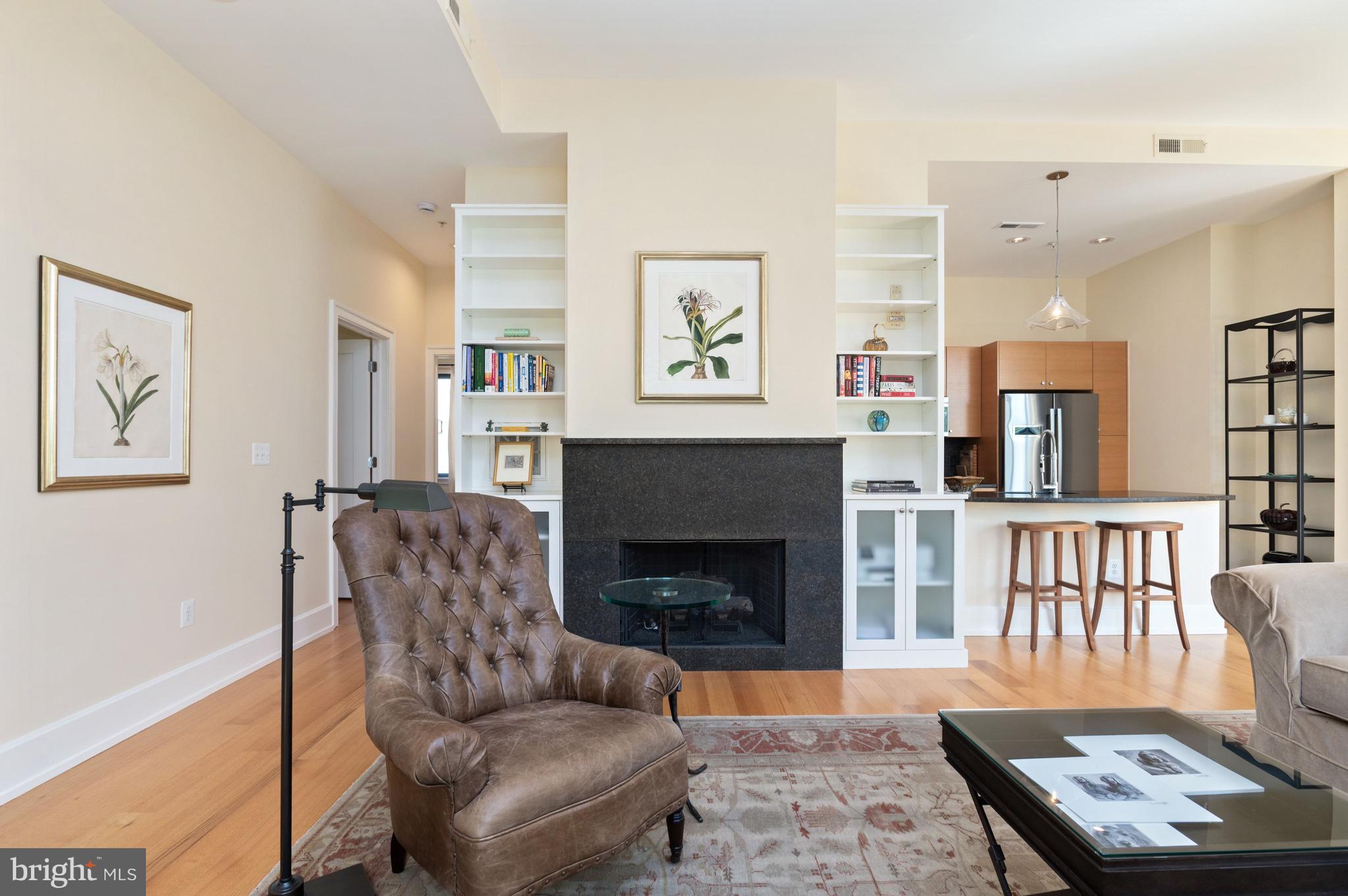 2516 Q Street Northwest, Unit C201 Washington, DC 20007 - Photo 4 of 20 a living room with furniture and a fireplace