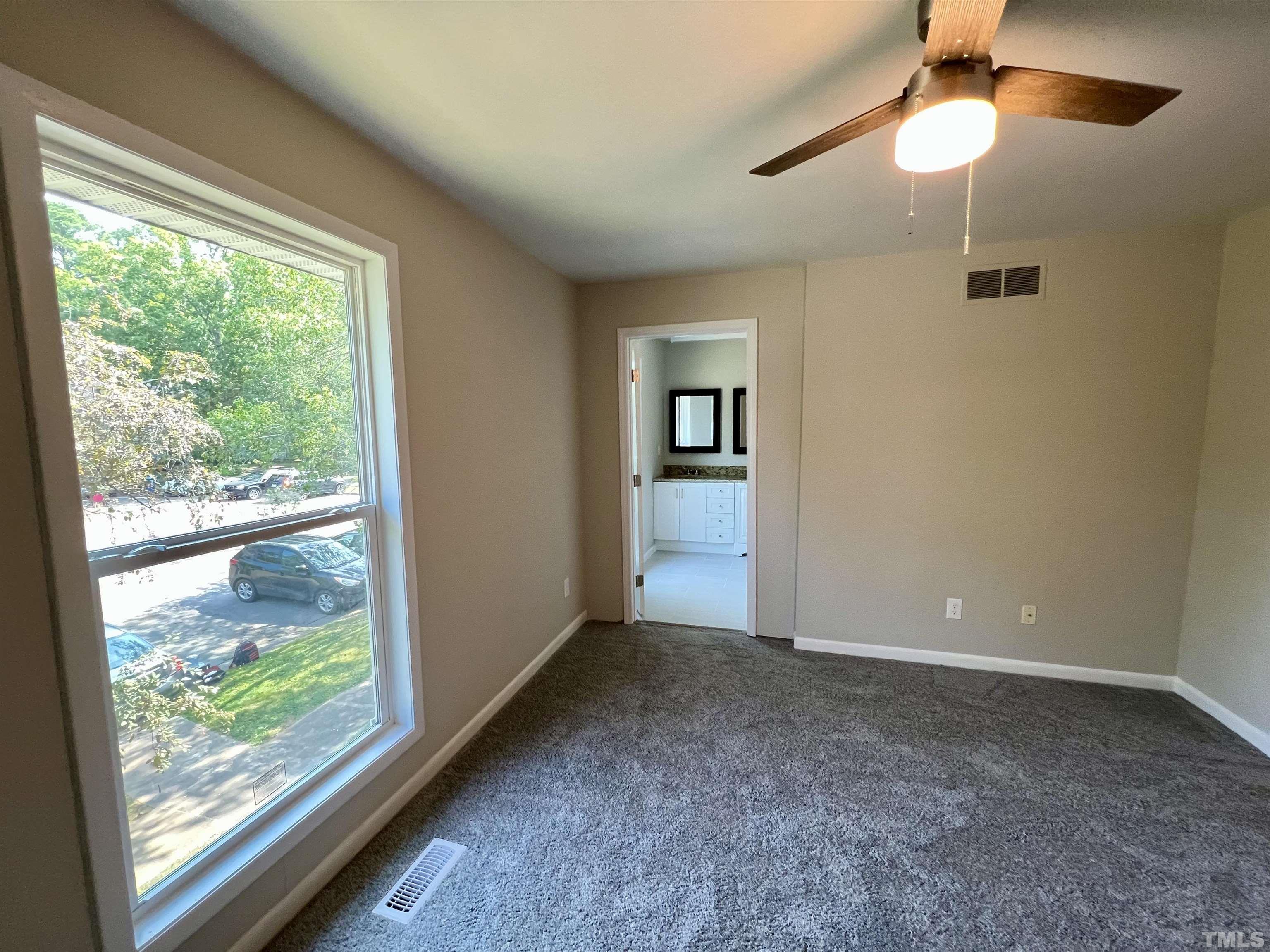 1304 Seaton Road Durham, NC 27713 - Photo 12 of 18 a view of an empty room with a window