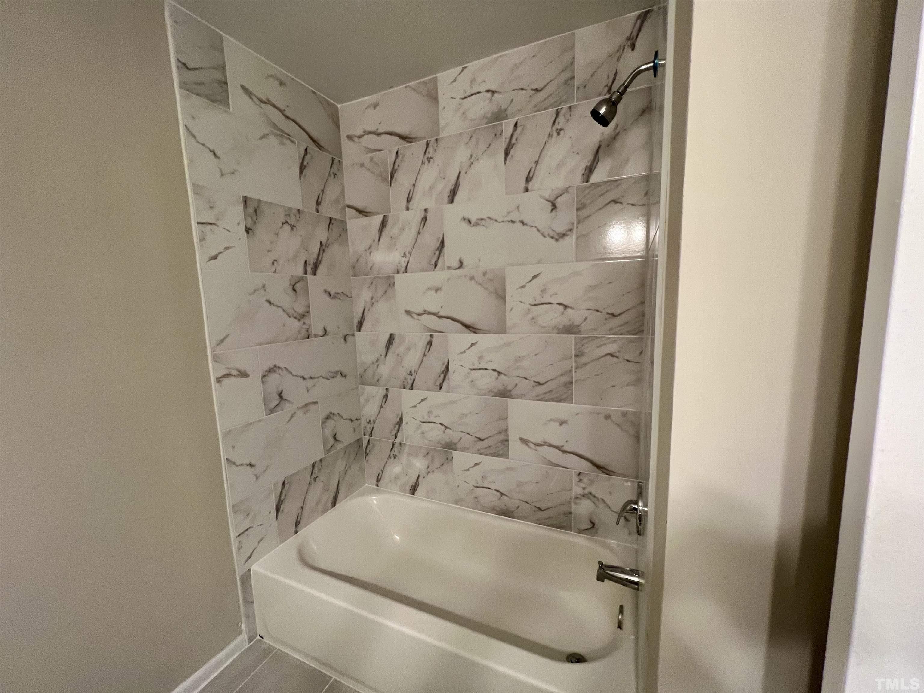 1304 Seaton Road Durham, NC 27713 - Photo 14 of 18 a bathroom with a shower and a sink