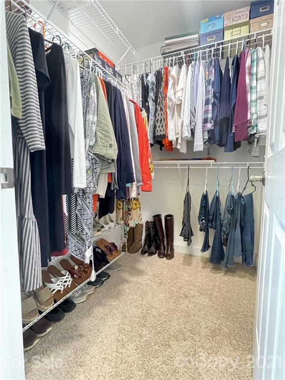 4004 Lamington Road Matthews, NC 28105 - Photo 13 of 31 a view of walk in closet with clothes and shoes