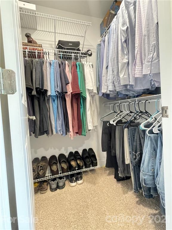4004 Lamington Road Matthews, NC 28105 - Photo 14 of 31 a view of walk in closet with clothes and shoes