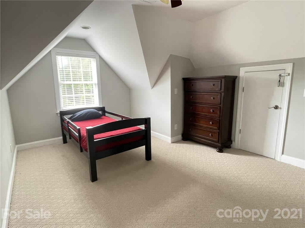 4004 Lamington Road Matthews, NC 28105 - Photo 24 of 31 a spacious bedroom with a bed and window