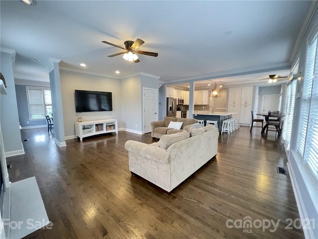4004 Lamington Road Matthews, NC 28105 - Photo 5 of 31 a living room with furniture wooden floor and a flat screen tv