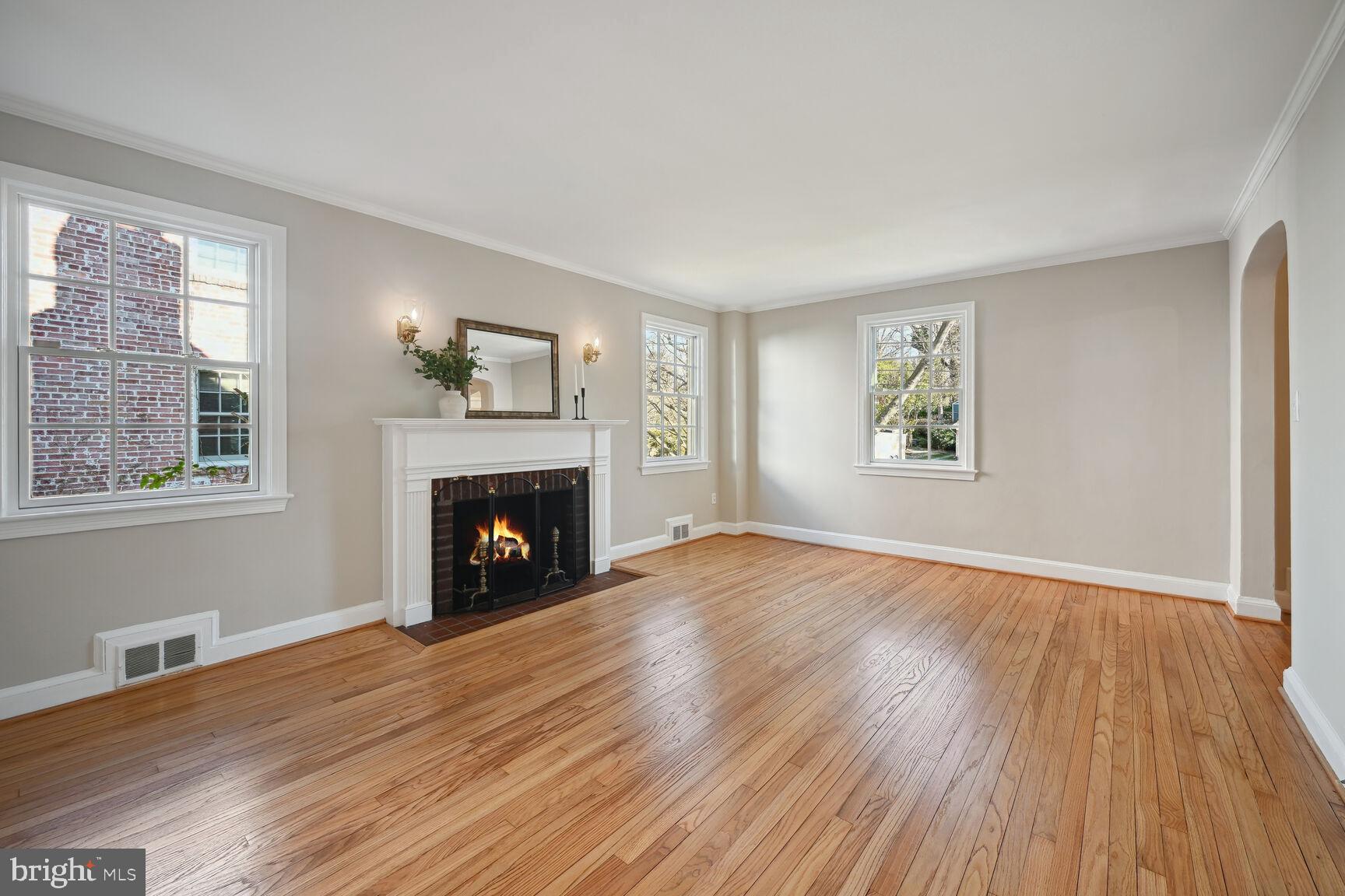 315 Ellsworth Drive Silver Spring, MD 20910 - Photo 10 of 49 Cozy wood burning fireplace and crown molding