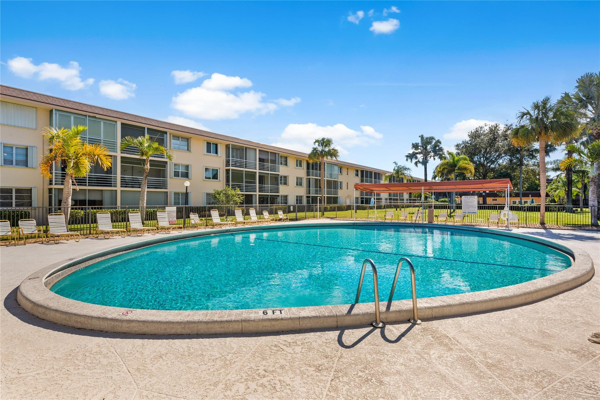 4500 North Federal Highway, Unit 156 Lighthouse Point, FL 33064 - Photo 14 of 23 a view of swimming pool with outdoor seating and plants