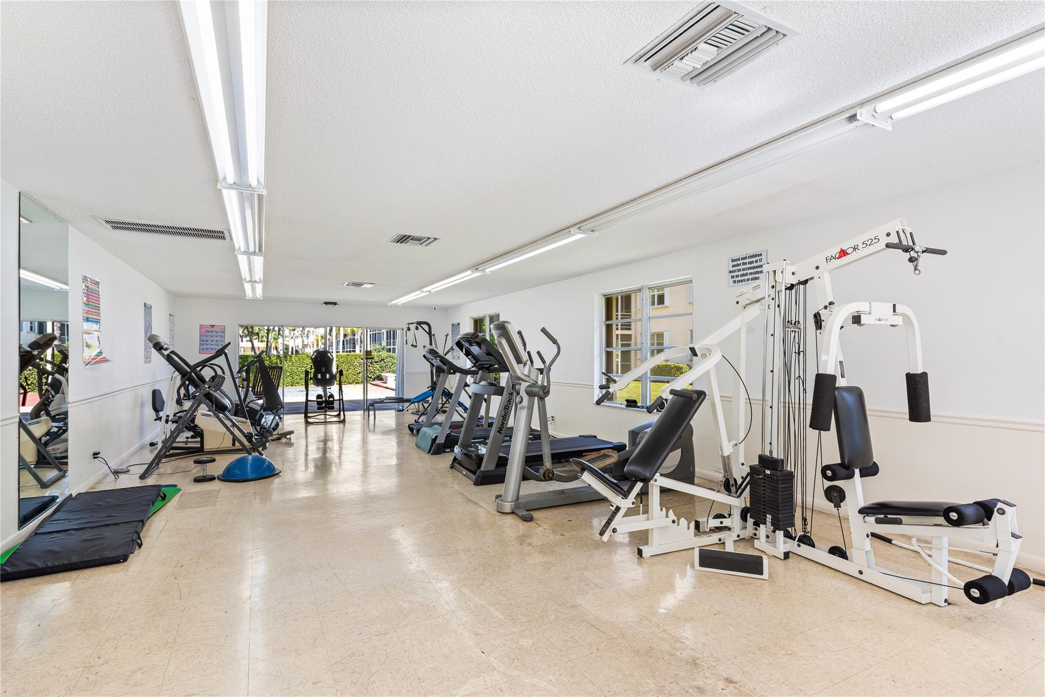 4500 North Federal Highway, Unit 156 Lighthouse Point, FL 33064 - Photo 16 of 23 a view of a room with gym equipment
