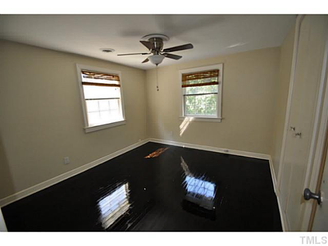 1000 Nichols Drive Raleigh, NC 27605 - Photo 11 of 21 2nd bedroom has new paint, refinished floors and new fan/light fixture.