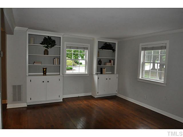 1000 Nichols Drive Raleigh, NC 27605 - Photo 3 of 21 Built-ins offer flexibility for decorating and hiding A/V equipment.