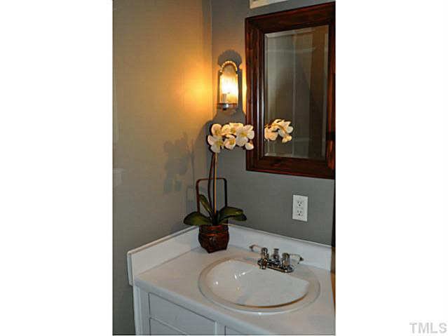 1000 Nichols Drive Raleigh, NC 27605 - Photo 7 of 21 Updated decor and new flooring in the pwder room on the 1st floor.