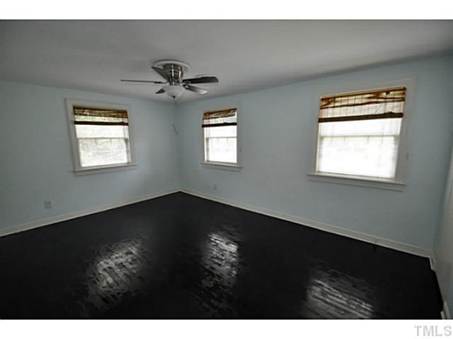 1000 Nichols Drive Raleigh, NC 27605 - Photo 10 of 21 Master bedroom has two closets, refinished floors, new paint and new fan/light.
