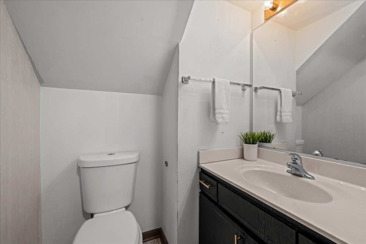 2691 Stanton Court Aurora, IL 60502 - Photo 12 of 17 a bathroom with a granite countertop sink toilet and mirror