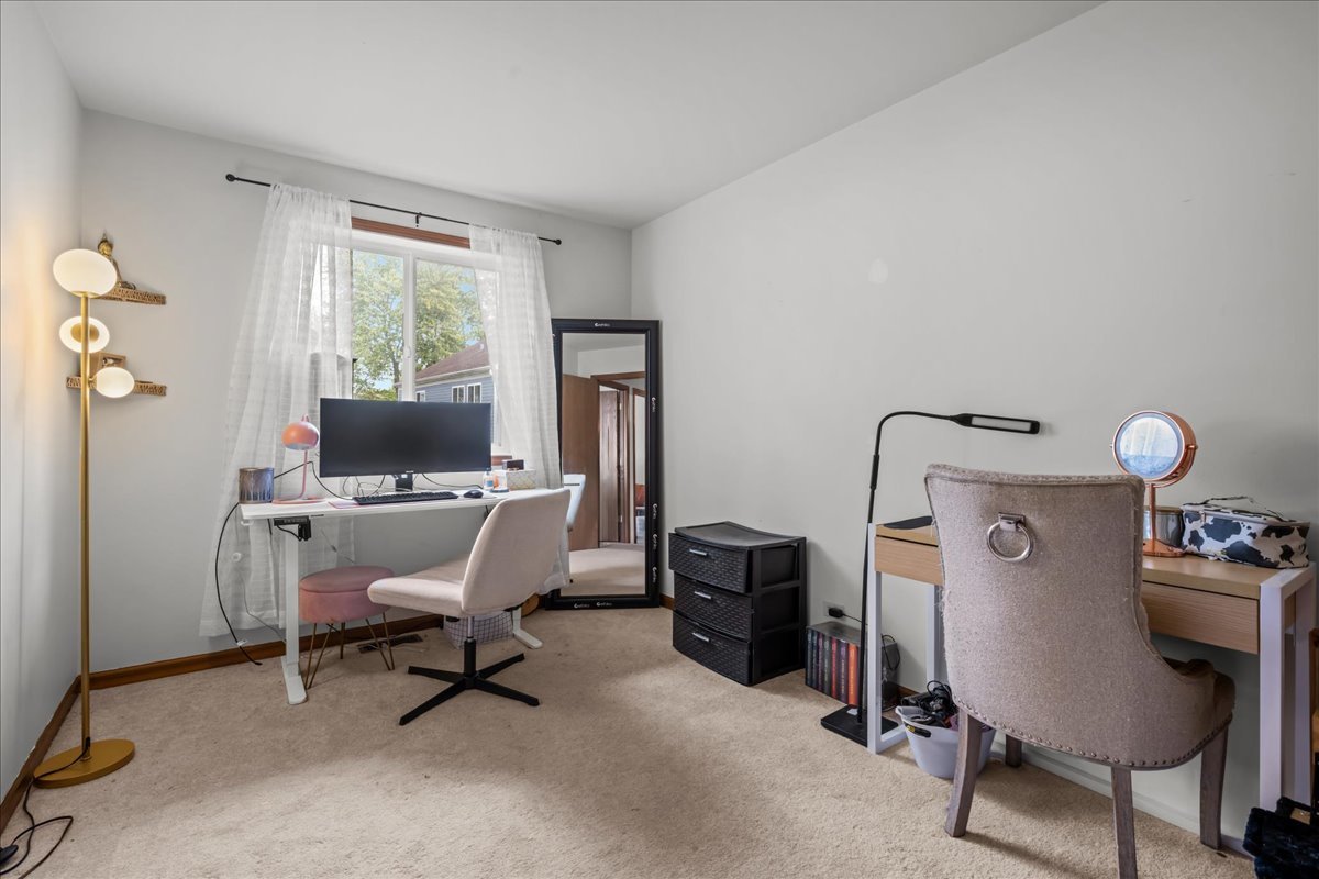 2691 Stanton Court Aurora, IL 60502 - Photo 16 of 17 a view of a workspace with furniture and a window