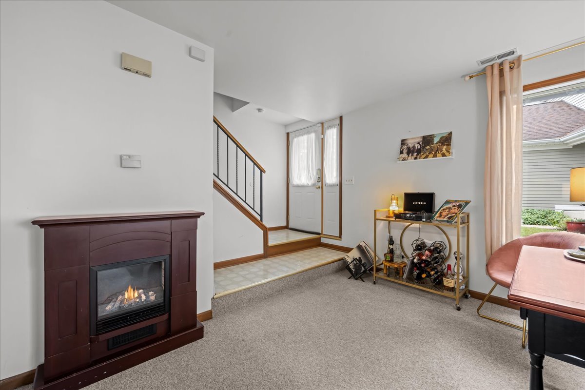 2691 Stanton Court Aurora, IL 60502 - Photo 3 of 17 a view of a livingroom with furniture and a fireplace