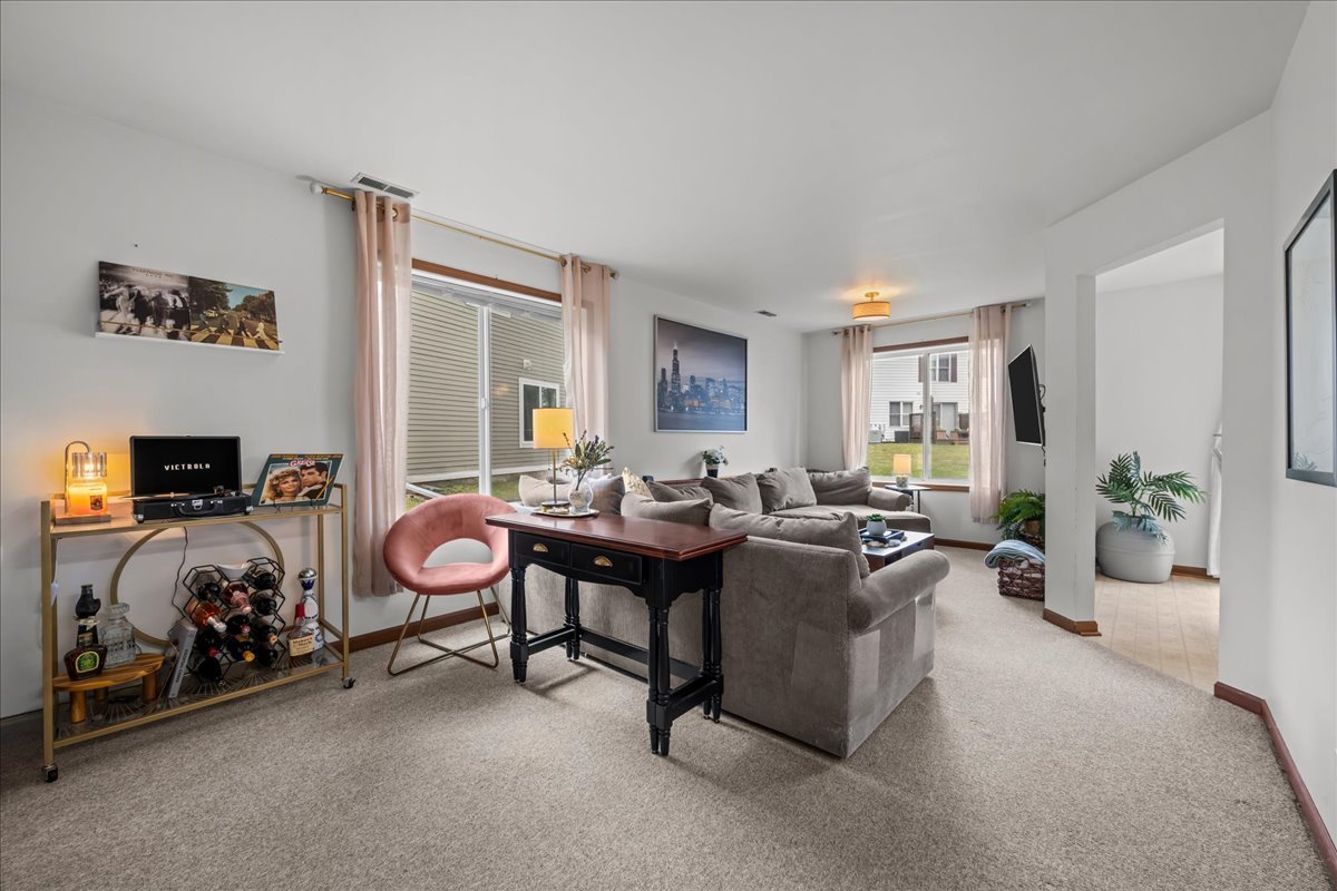 2691 Stanton Court Aurora, IL 60502 - Photo 4 of 17 a living room with furniture a couch and a window