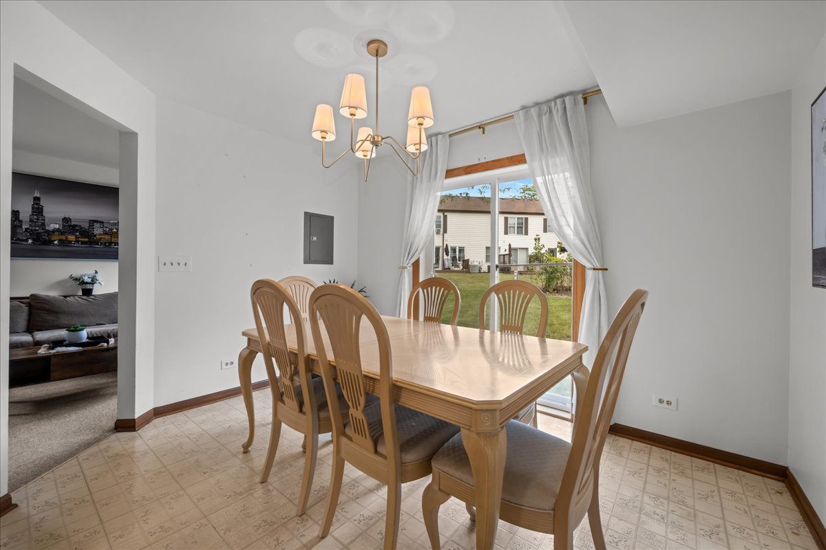 2691 Stanton Court Aurora, IL 60502 - Photo 7 of 17 a view of a dining room with furniture window and outside view