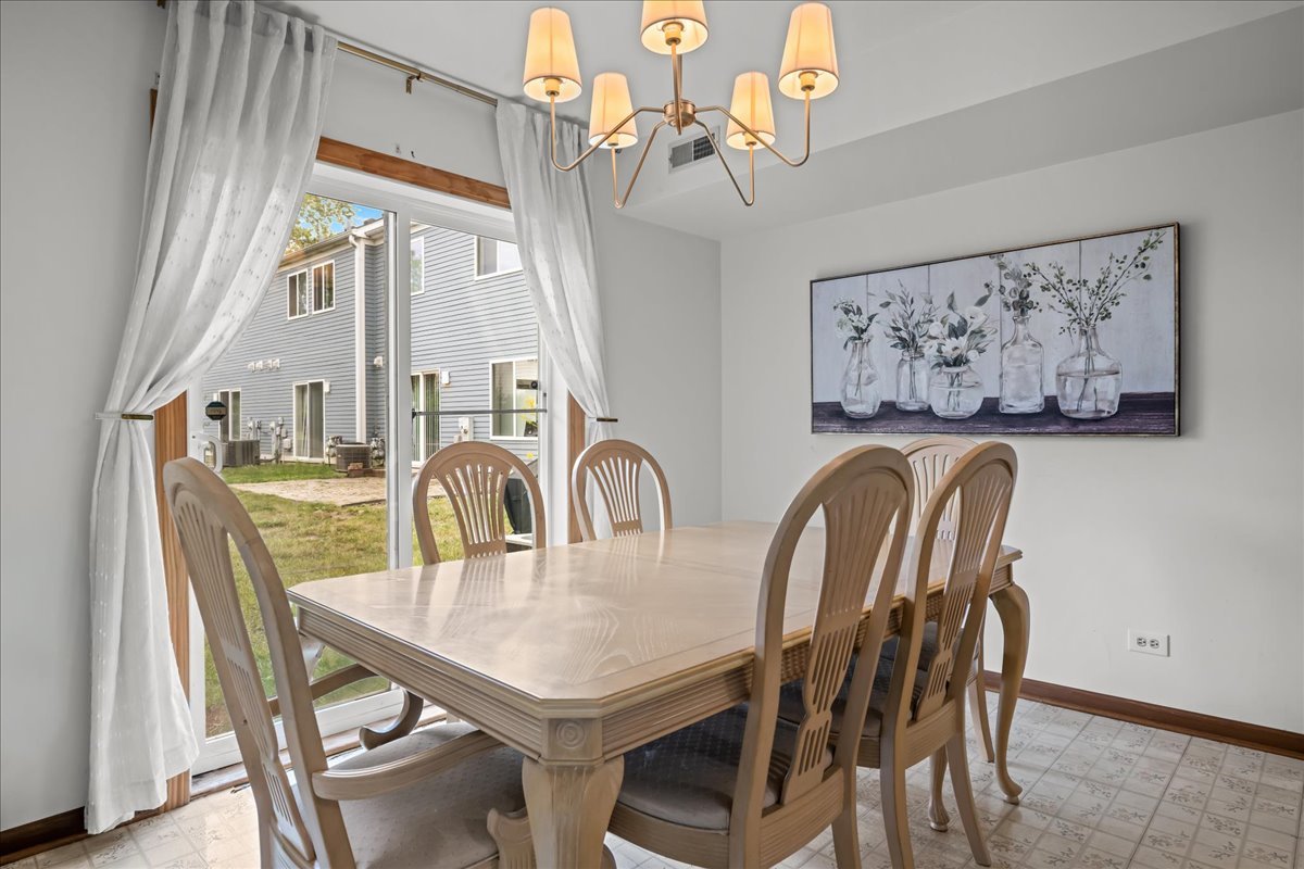 2691 Stanton Court Aurora, IL 60502 - Photo 8 of 17 a view of a dining room with furniture