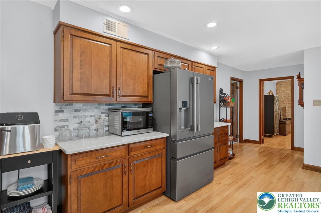 1830 Sherwood Road Allentown, PA 18103 - Photo 11 of 68 a kitchen with stainless steel appliances granite countertop a refrigerator and a sink