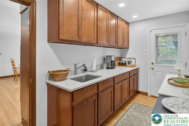 a view of a dining room with furniture and a chandelier
