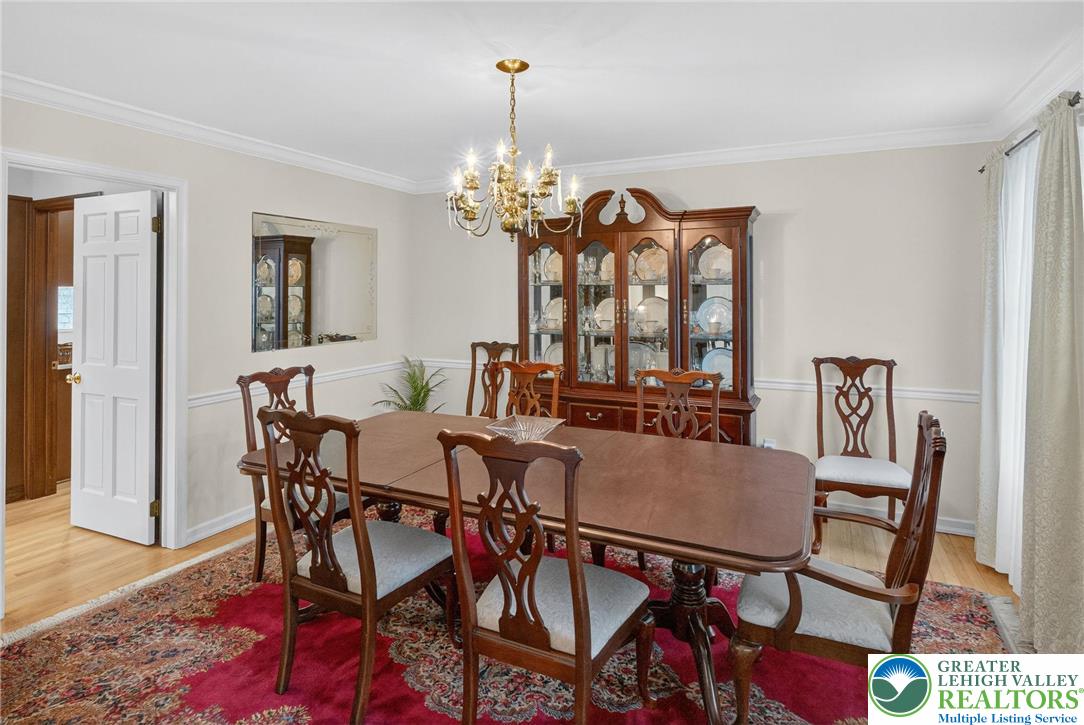 1830 Sherwood Road Allentown, PA 18103 - Photo 17 of 68 a view of a dining room with furniture and a chandelier