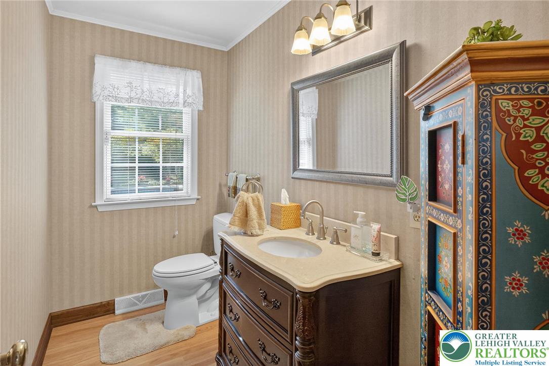1830 Sherwood Road Allentown, PA 18103 - Photo 18 of 68 a bathroom with a sink toilet and mirror
