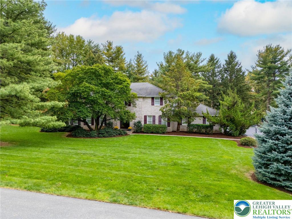 1830 Sherwood Road Allentown, PA 18103 - Photo 2 of 68 a front view of a house with a yard and trees