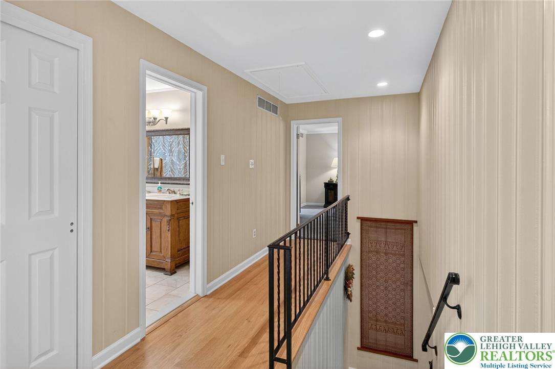 1830 Sherwood Road Allentown, PA 18103 - Photo 24 of 68 a view of a hallway with wooden floor and staircase