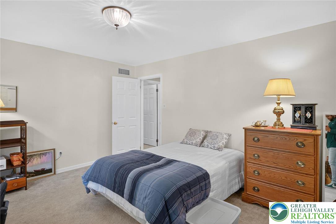 1830 Sherwood Road Allentown, PA 18103 - Photo 26 of 68 a bedroom with a bed and a dresser