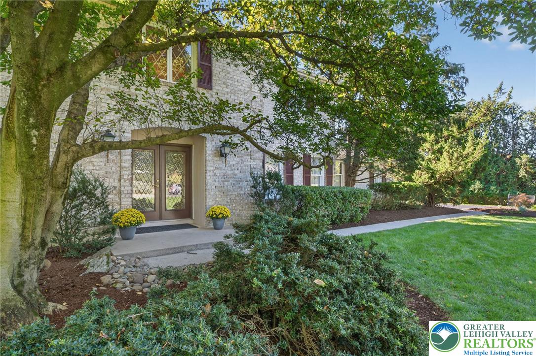 1830 Sherwood Road Allentown, PA 18103 - Photo 3 of 68 a front view of a house with garden