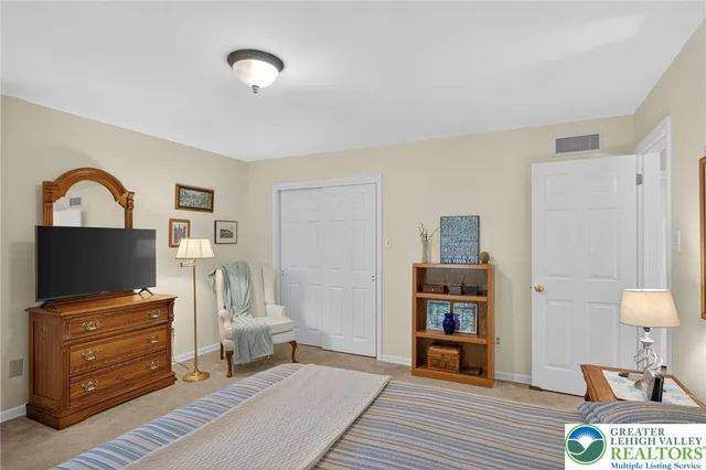 a bathroom with a shower sink vanity and mirror