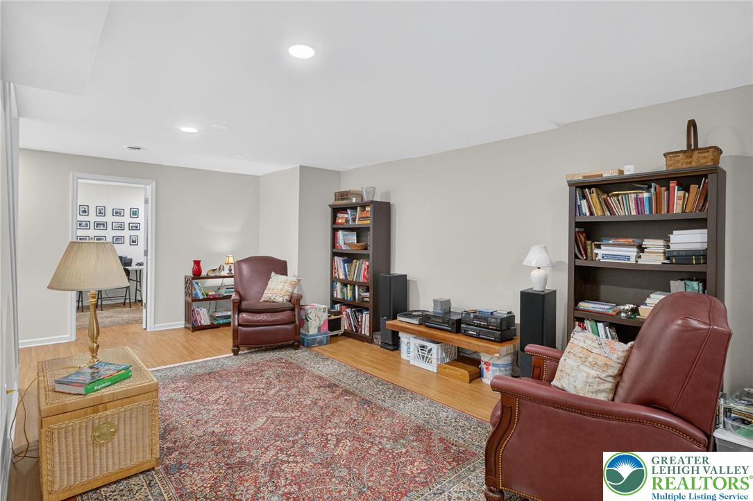 1830 Sherwood Road Allentown, PA 18103 - Photo 39 of 68 a living room with furniture and a book shelf