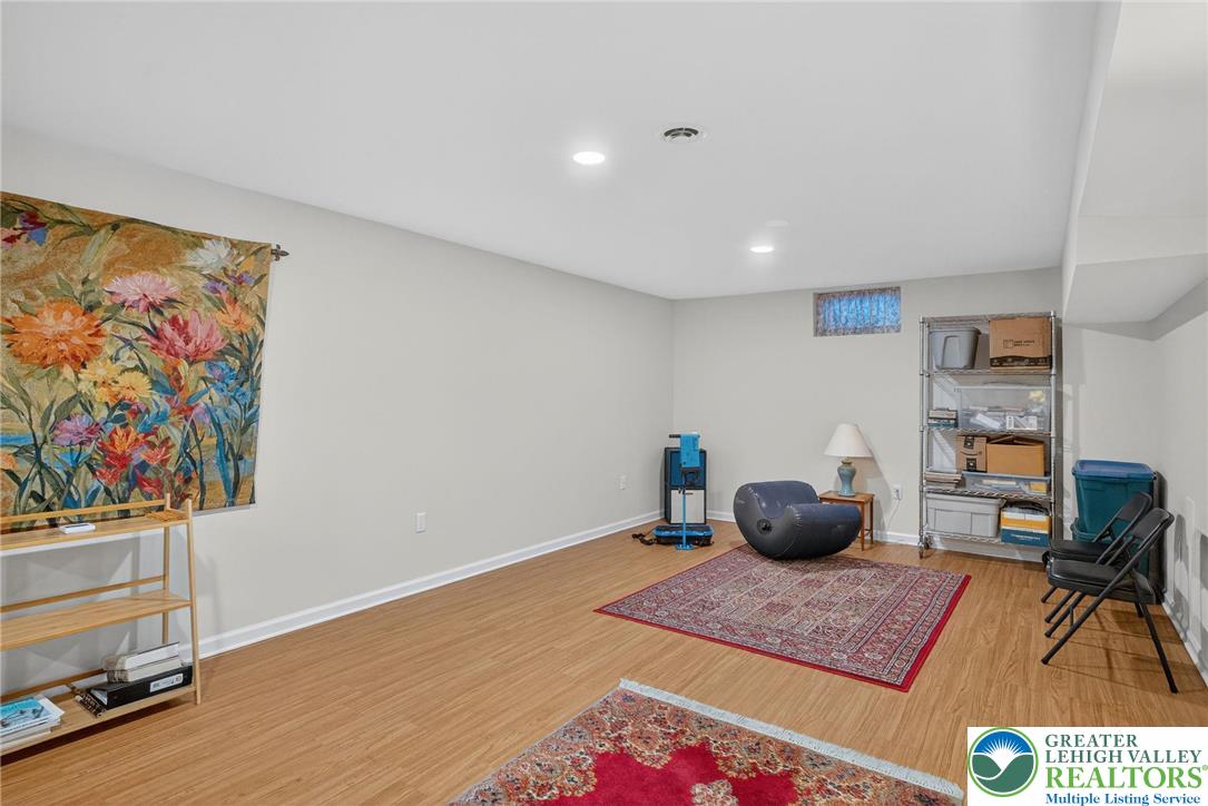 1830 Sherwood Road Allentown, PA 18103 - Photo 40 of 68 a room with furniture and a book shelf