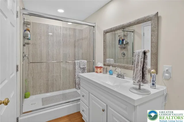 an aerial view of a residential houses with yard