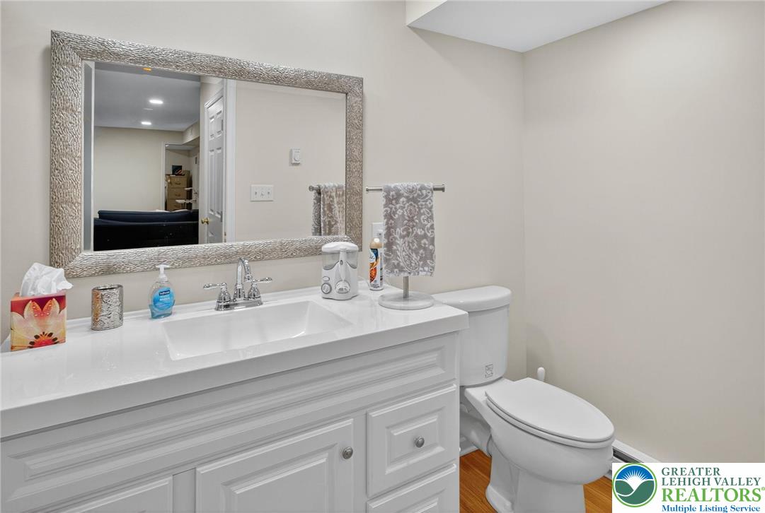 1830 Sherwood Road Allentown, PA 18103 - Photo 47 of 68 a bathroom with a toilet sink and mirror