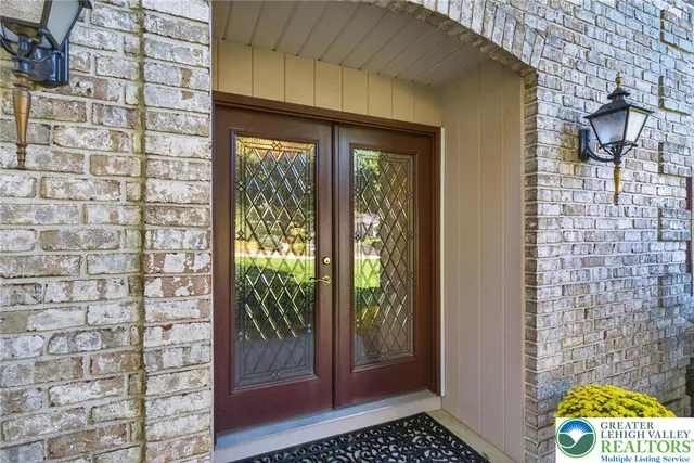 a view of a livingroom and a window with wooden floor