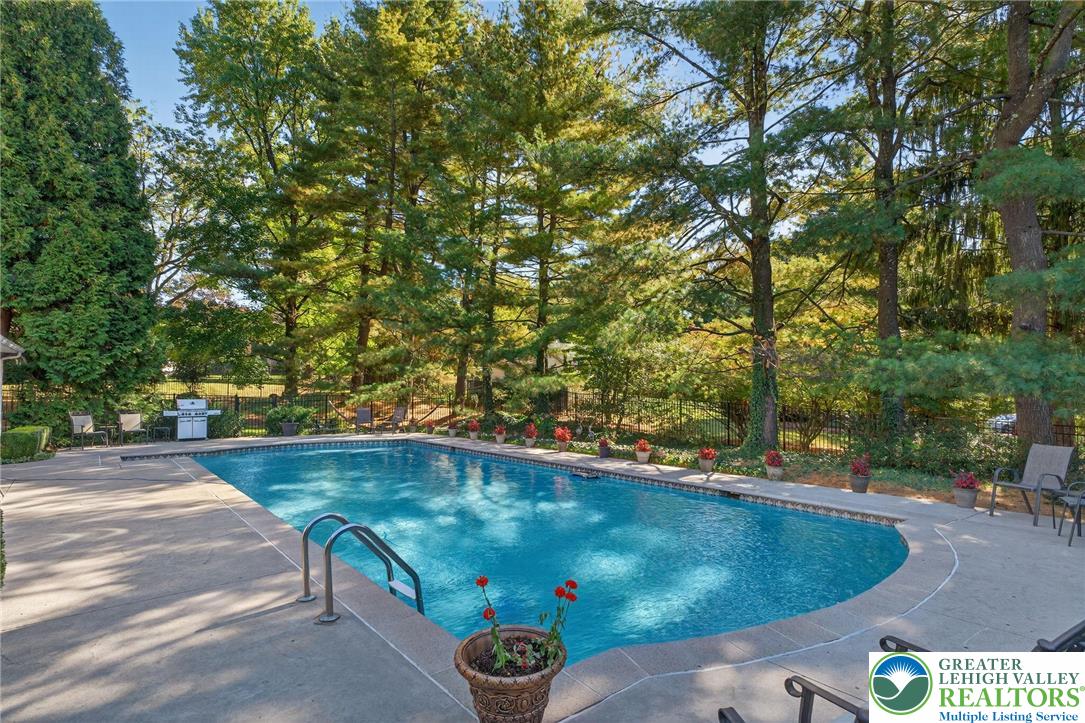 1830 Sherwood Road Allentown, PA 18103 - Photo 52 of 68 a view of a swimming pool with a yard