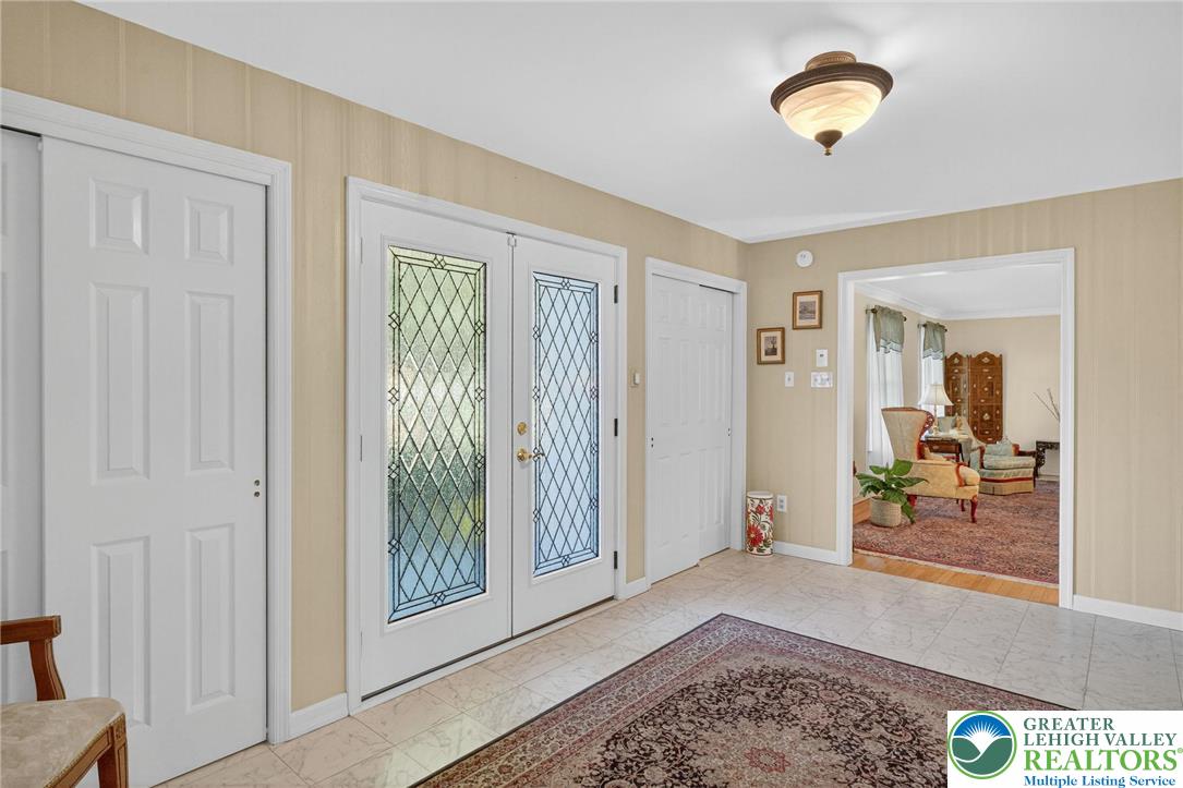 1830 Sherwood Road Allentown, PA 18103 - Photo 6 of 68 a view of a livingroom and a window with wooden floor