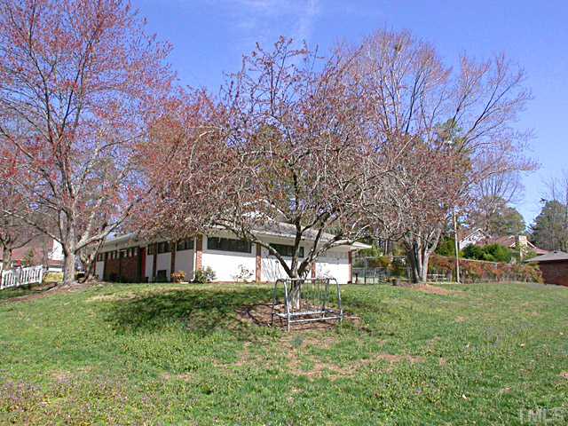 1515 Laureldale Drive Raleigh, NC 27609 - Photo 22 of 25 a front view of a house with garden