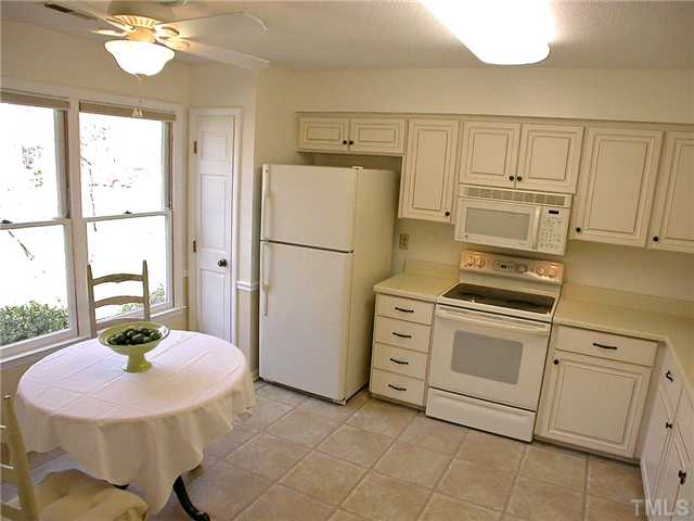 1515 Laureldale Drive Raleigh, NC 27609 - Photo 8 of 25 a kitchen with cabinets and appliances