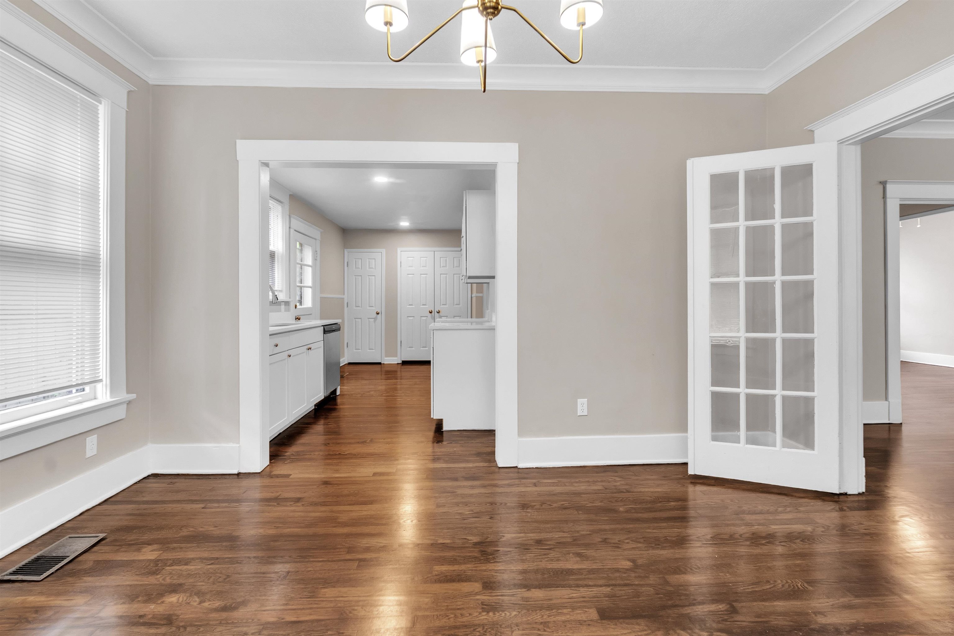 2579 Hale Avenue Memphis, TN 38112 - Photo 12 of 21 an empty room with wooden floor and windows