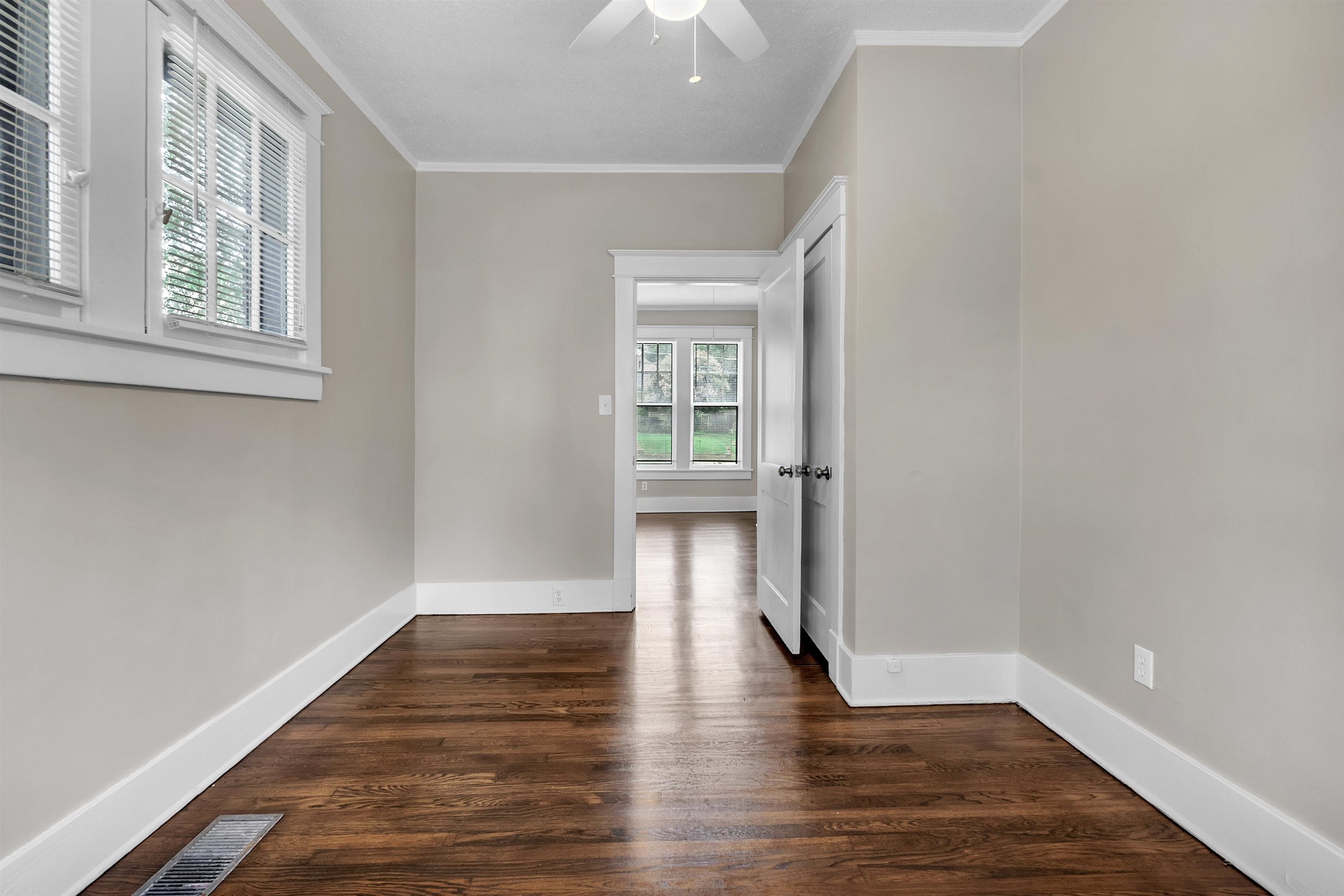 2579 Hale Avenue Memphis, TN 38112 - Photo 18 of 21 a view of an empty room with wooden floor and a window