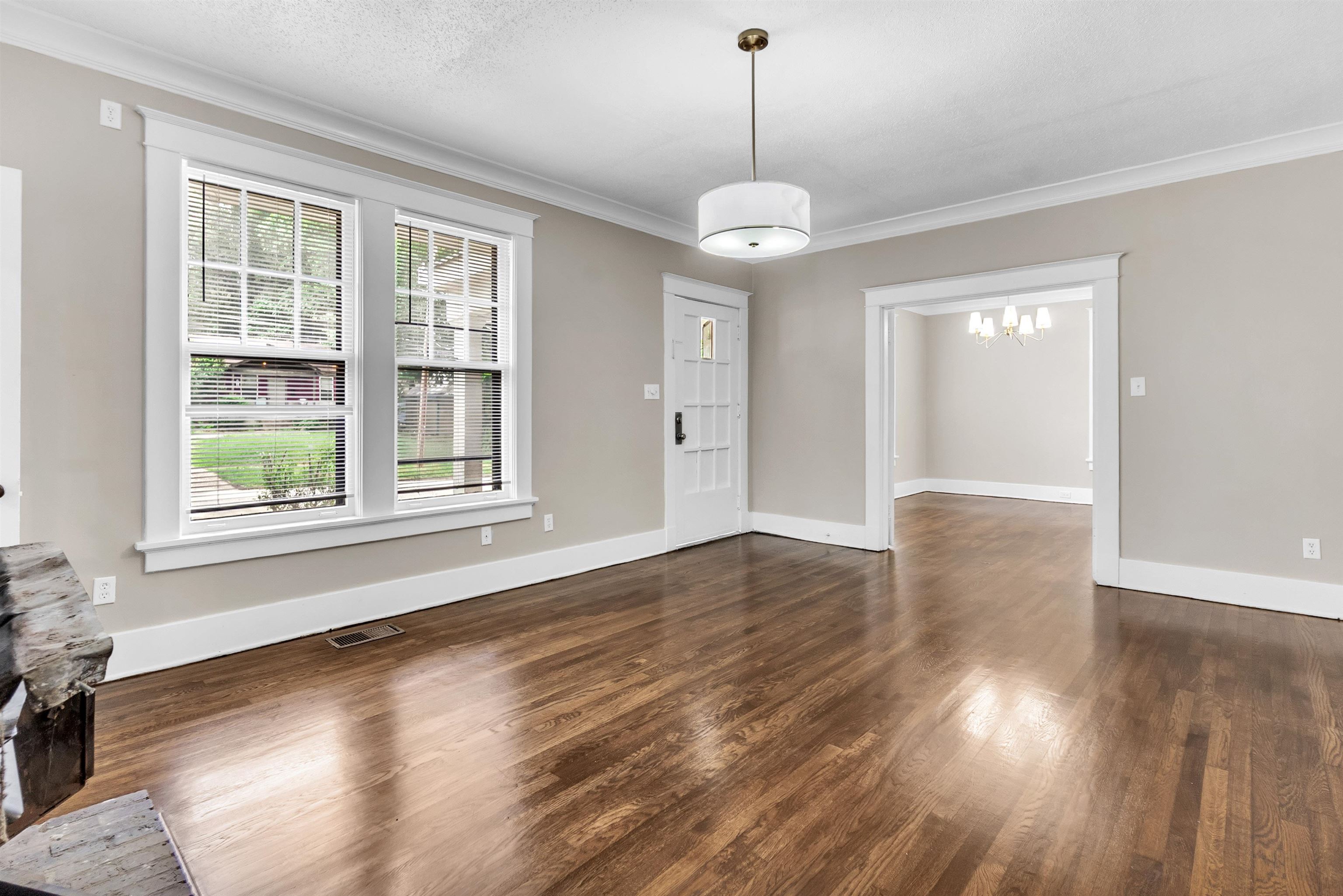 2579 Hale Avenue Memphis, TN 38112 - Photo 5 of 21 a view of an empty room with wooden floor and a window