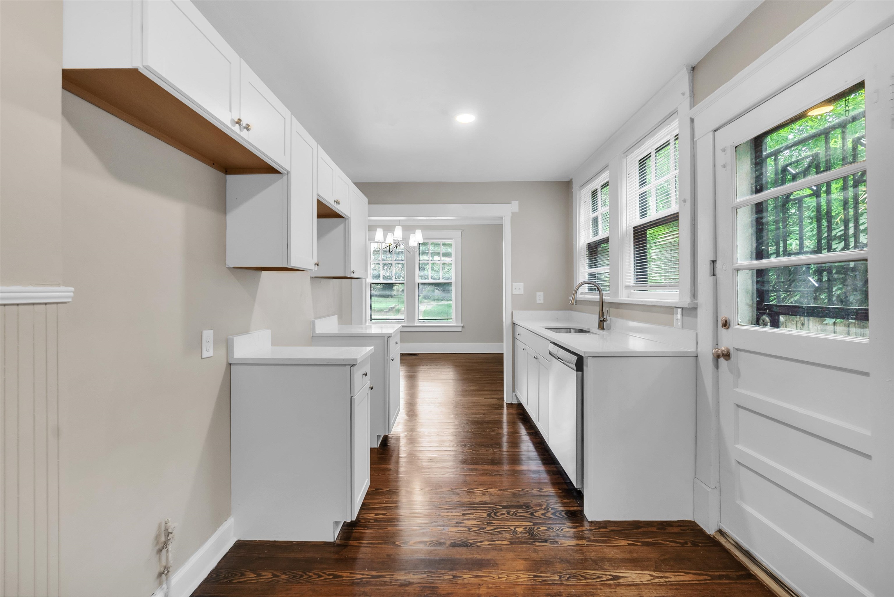 2579 Hale Avenue Memphis, TN 38112 - Photo 9 of 21 a kitchen with a refrigerator and white cabinets