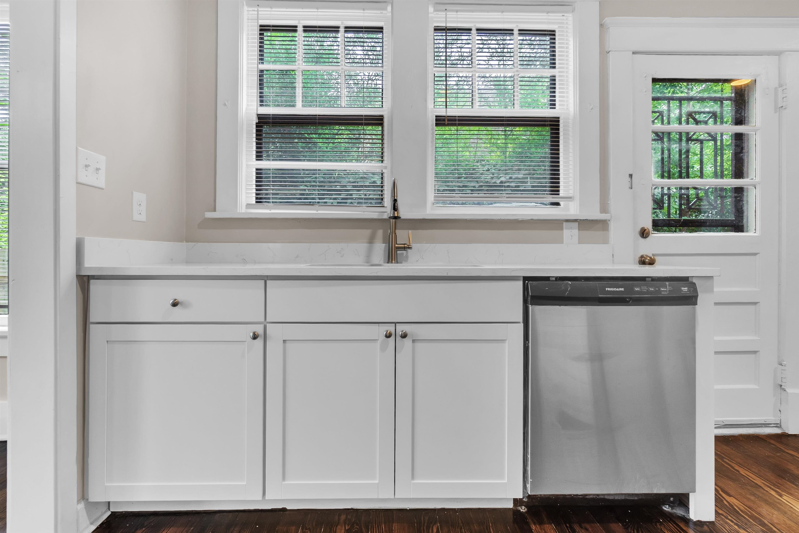 2579 Hale Avenue Memphis, TN 38112 - Photo 10 of 21 a kitchen with granite countertop white cabinets and a window
