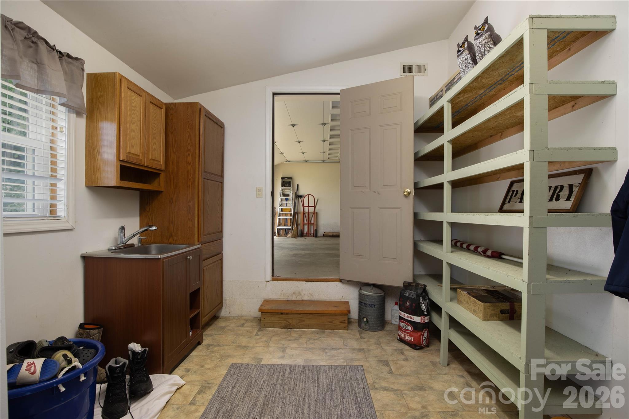 84 Sheets Farm Road Bakersville, NC 28705 - Photo 21 of 42 a view of walk in closet with clothes and shoes