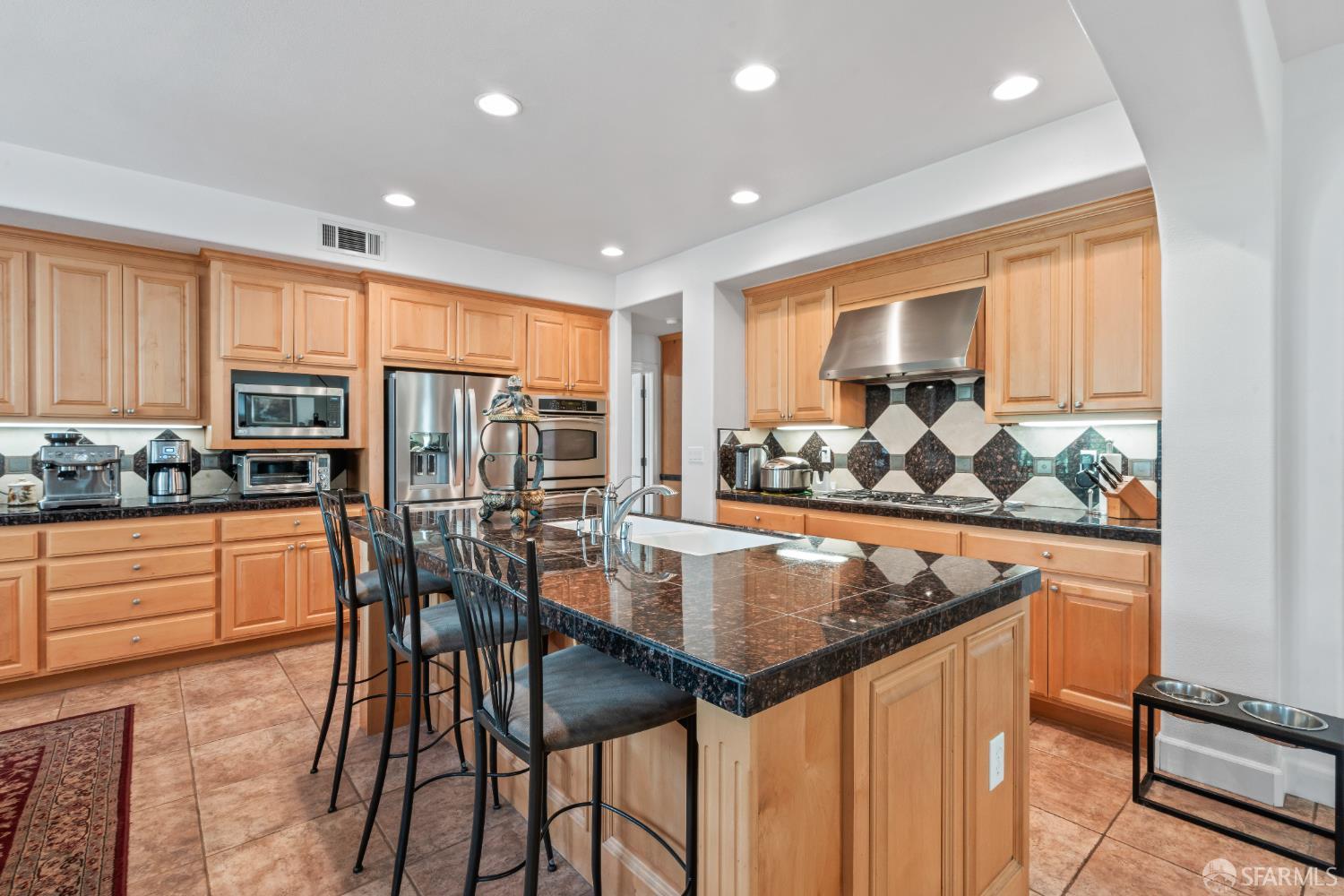 103 Abalone Cove Hercules, CA 94547 - Photo 15 of 84 a kitchen with stainless steel appliances granite countertop table chairs sink and stove
