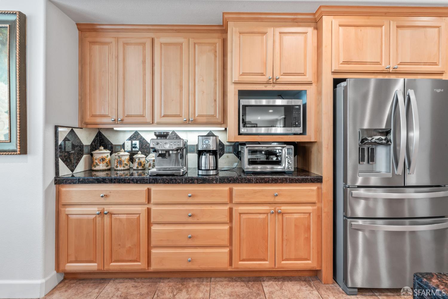 103 Abalone Cove Hercules, CA 94547 - Photo 27 of 84 a kitchen with granite countertop white cabinets and stainless steel appliances