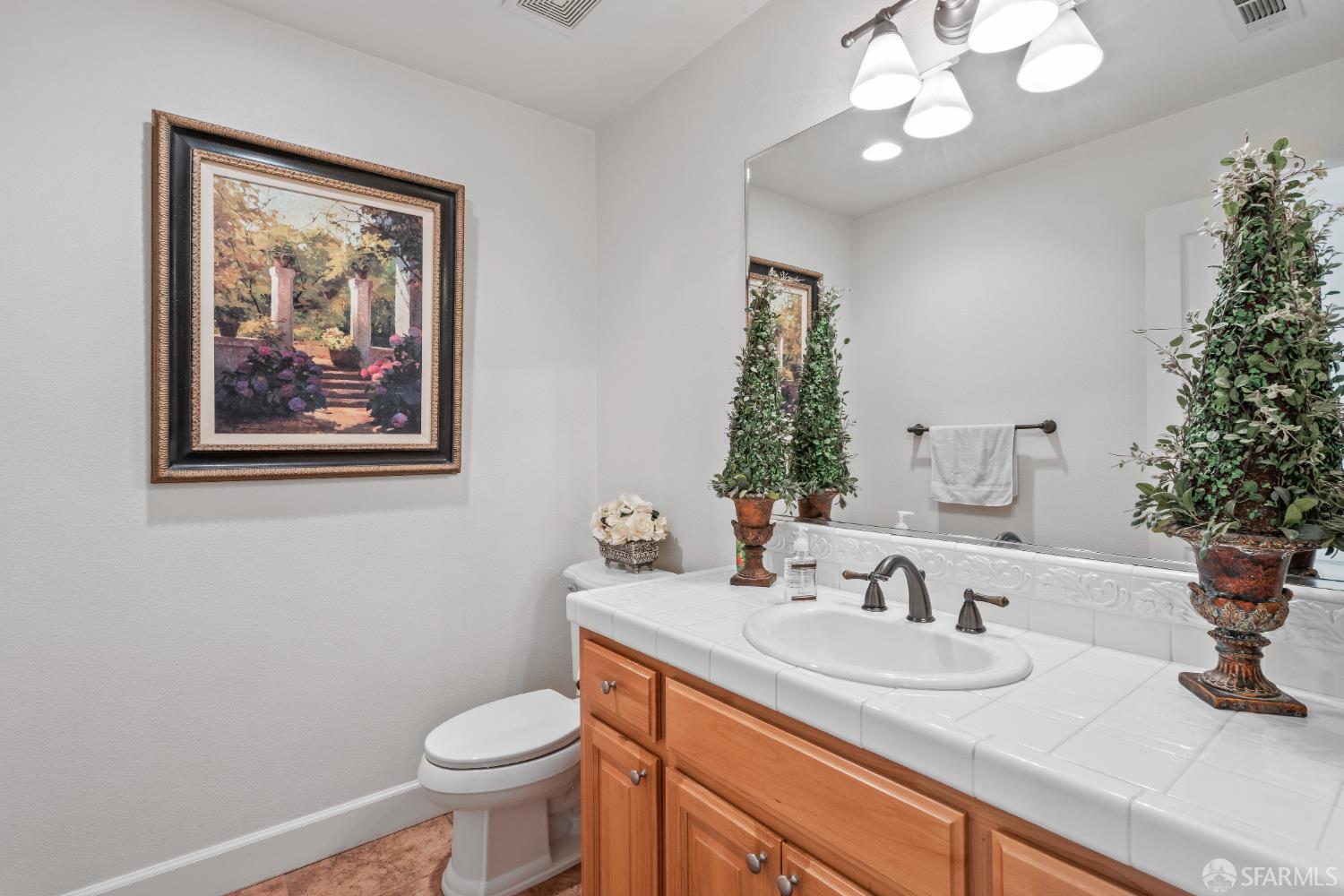 103 Abalone Cove Hercules, CA 94547 - Photo 31 of 84 a bathroom with a toilet sink and mirror